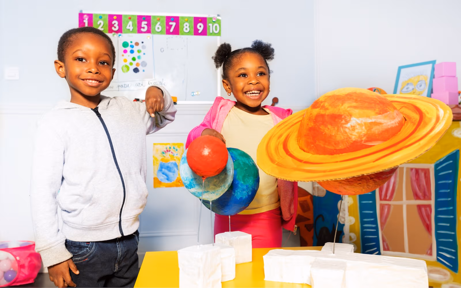 Preschoolers presenting a solar system science project at New Life Early Learning Academy